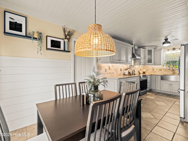 433 Dion Dr, Hubert, NC 28539 - dining room with light tile patterned flooring, a ceiling fan, and wood ceiling