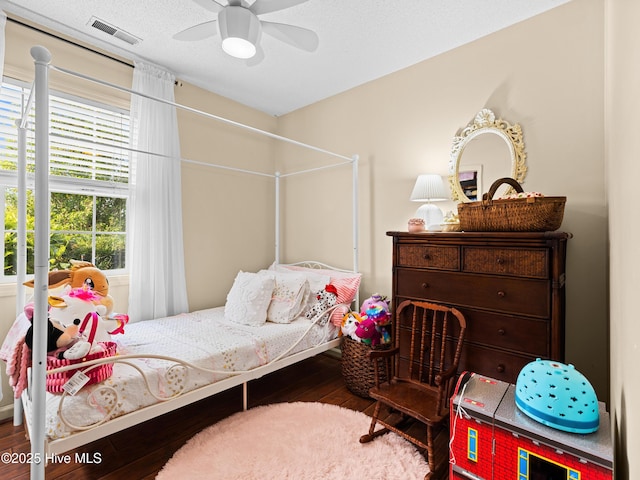 433 Dion Dr, Hubert, NC 28539 - bedroom with visible vents, a ceiling fan, and wood-type flooring