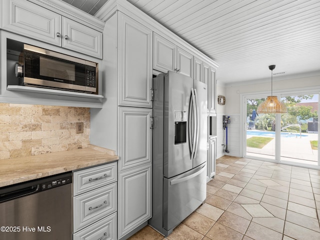 433 Dion Dr, Hubert, NC 28539 - kitchen featuring appliances with stainless steel finishes, light countertops, light tile patterned floors, tasteful backsplash, and white cabinetry