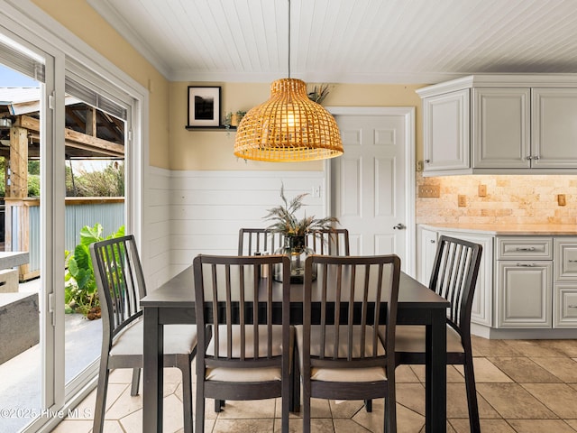 433 Dion Dr, Hubert, NC 28539 - dining area with wooden ceiling, crown molding, and wainscoting