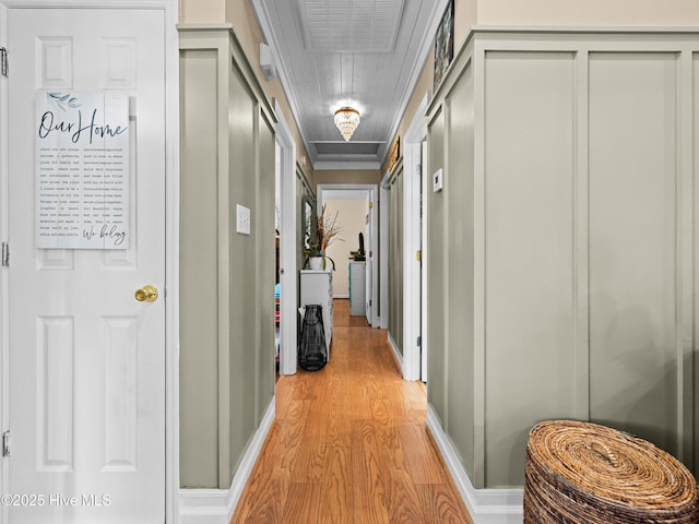 433 Dion Dr, Hubert, NC 28539 - corridor featuring light wood finished floors, baseboards, attic access, and ornamental molding