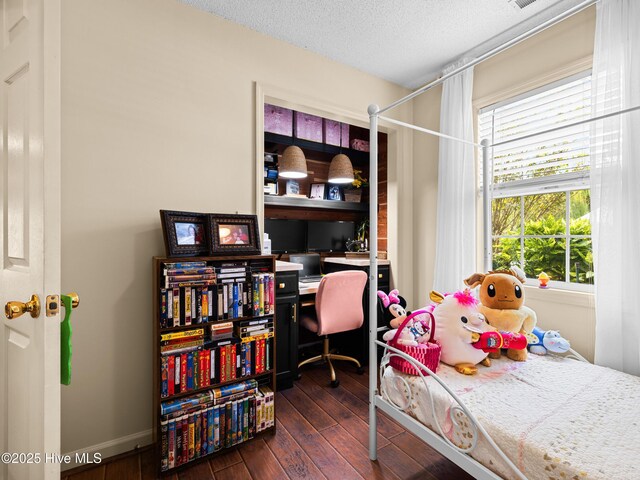 433 Dion Dr, Hubert, NC 28539 - bedroom with a textured ceiling, ceiling fan, wood finished floors, and visible vents