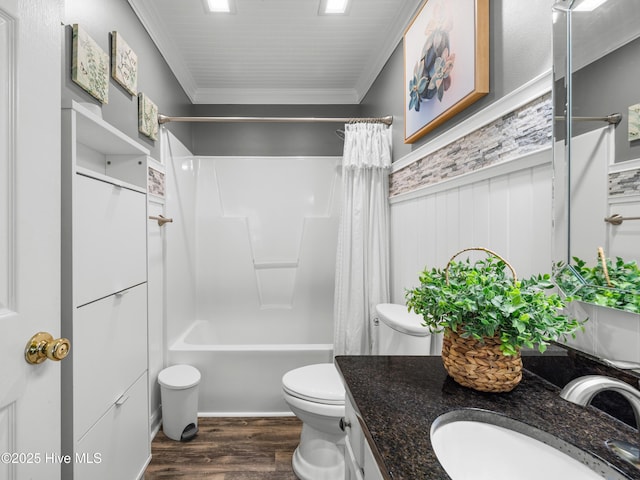 433 Dion Dr, Hubert, NC 28539 - full bathroom featuring toilet, crown molding, vanity, wood finished floors, and shower / bath combo with shower curtain