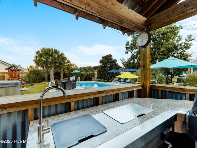 433 Dion Dr, Hubert, NC 28539 - exterior space featuring fence, an outdoor pool, and a playground