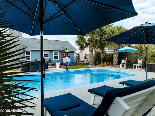 433 Dion Dr, Hubert, NC 28539 - pool featuring a playground, a patio area, fence, and an outdoor hangout area