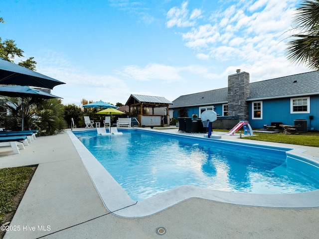 433 Dion Dr, Hubert, NC 28539 - outdoor pool with a gazebo, central AC, and a patio