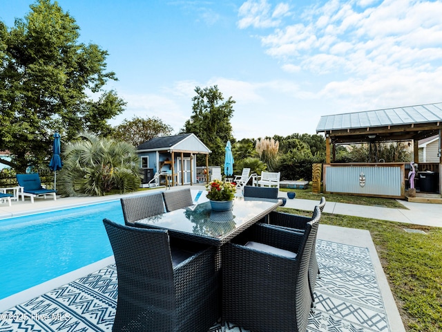 433 Dion Dr, Hubert, NC 28539 - view of patio featuring outdoor dining space, a gazebo, an outdoor pool, an outdoor structure, and an exterior structure