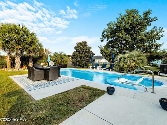 433 Dion Dr, Hubert, NC 28539 - outdoor pool with a patio, a lawn, fence, and outdoor dining space