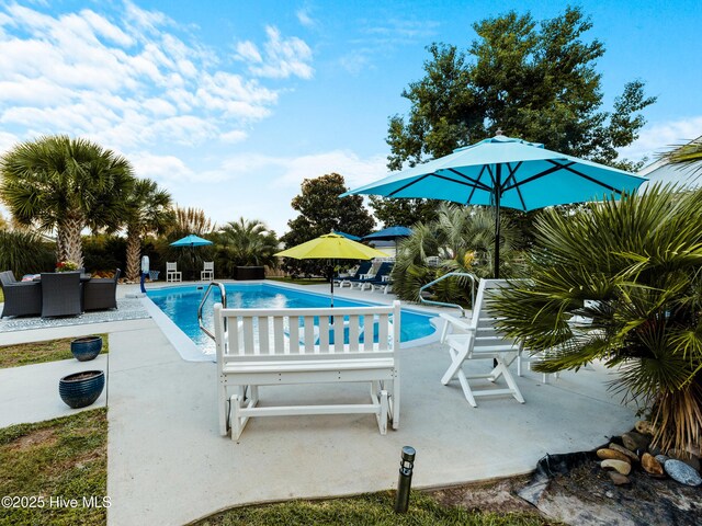 433 Dion Dr, Hubert, NC 28539 - pool featuring a playground, a patio area, and outdoor dining space