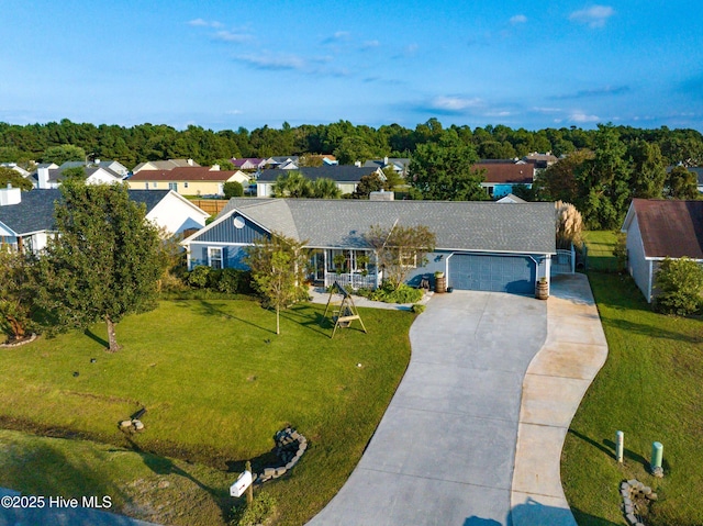 433 Dion Dr, Hubert, NC 28539 - single story home featuring an attached garage, driveway, a residential view, and a front yard