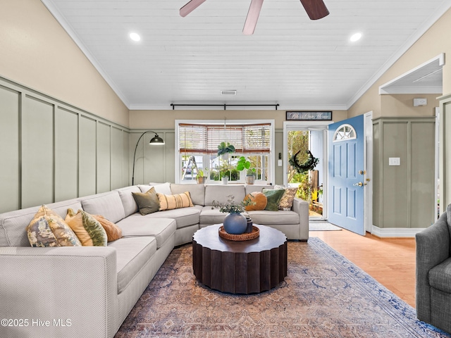 433 Dion Dr, Hubert, NC 28539 - living area featuring ceiling fan, a decorative wall, wood finished floors, and visible vents
