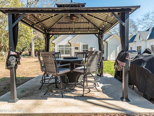 view of patio / terrace featuring a gazebo and outdoor dining space