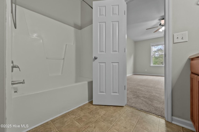 307 Cedar Island Trl, Holly Ridge, NC 28445 - full bathroom with tile patterned floors, washtub / shower combination, baseboards, and a ceiling fan