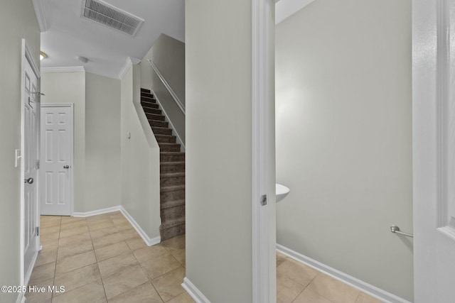 307 Cedar Island Trl, Holly Ridge, NC 28445 - stairway featuring ornamental molding, visible vents, tile patterned floors, and baseboards