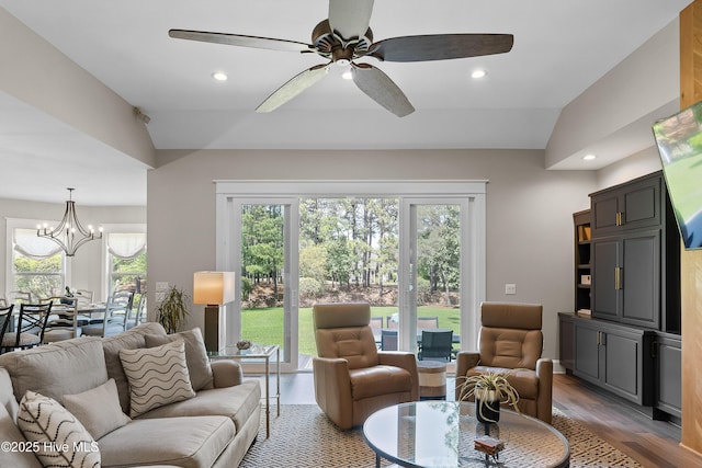 2592 St James Dr SE, Southport, NC 28461 - living area featuring wood finished floors, a ceiling fan, recessed lighting, a chandelier, and vaulted ceiling
