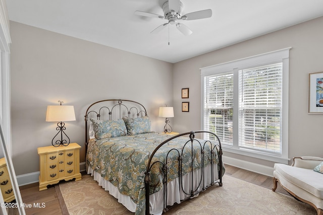 2592 St James Dr SE, Southport, NC 28461 - bedroom featuring wood finished floors, baseboards, and ceiling fan
