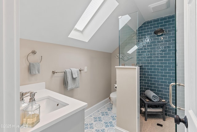 2592 St James Dr SE, Southport, NC 28461 - bathroom featuring a skylight, a shower stall, lofted ceiling, vanity, and toilet