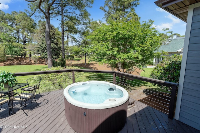 2592 St James Dr SE, Southport, NC 28461 - wooden deck featuring a hot tub