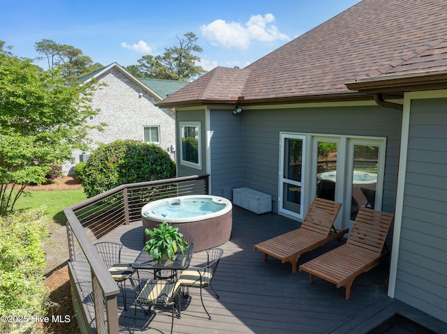 2592 St James Dr SE, Southport, NC 28461 - wooden terrace featuring a hot tub and outdoor dining area