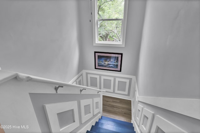 stairs with wood finished floors