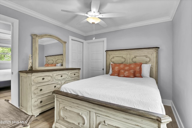 bedroom with a ceiling fan, wood finished floors, and ornamental molding