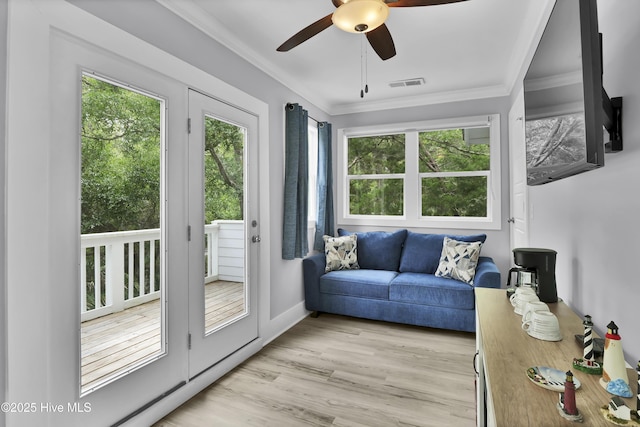 sunroom / solarium featuring plenty of natural light and visible vents