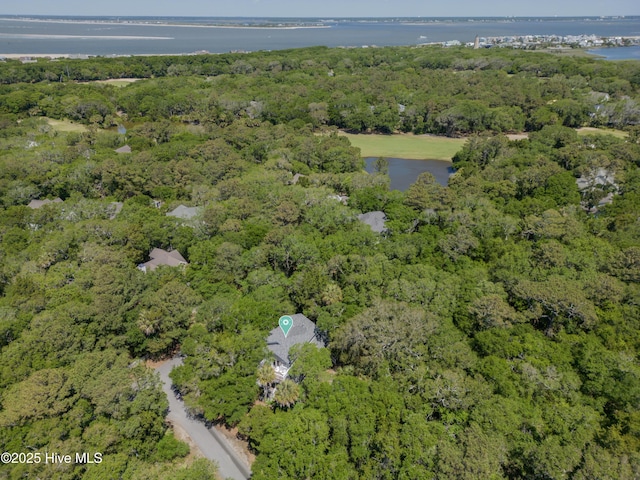 aerial view with a forest view and a water view