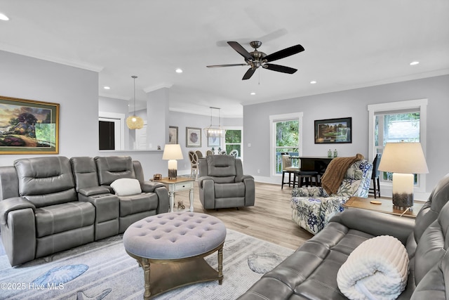living area with recessed lighting, light wood-style floors, a healthy amount of sunlight, and a ceiling fan