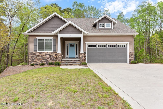 20 Barkley Ln, Pinehurst, NC 28374 - craftsman-style home featuring driveway, stone siding, a front yard, a garage, and a shingled roof