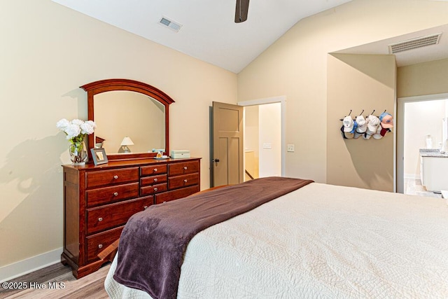 20 Barkley Ln, Pinehurst, NC 28374 - bedroom with visible vents, baseboards, vaulted ceiling, and wood finished floors