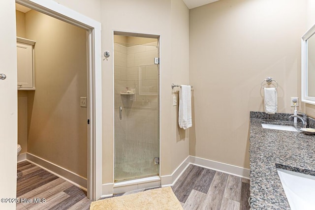 20 Barkley Ln, Pinehurst, NC 28374 - bathroom with vanity, baseboards, a stall shower, and wood finished floors