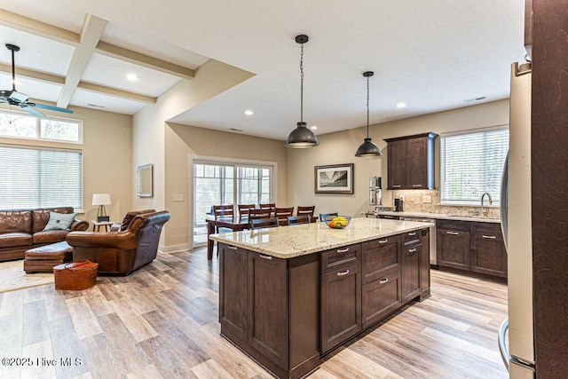 20 Barkley Ln, Pinehurst, NC 28374 - kitchen with dark brown cabinets, light wood-type flooring, recessed lighting, and a sink