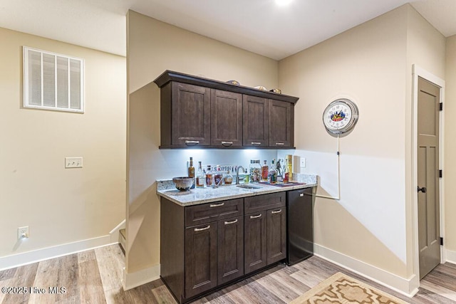 20 Barkley Ln, Pinehurst, NC 28374 - bar featuring dishwasher, visible vents, a sink, and light wood-style flooring