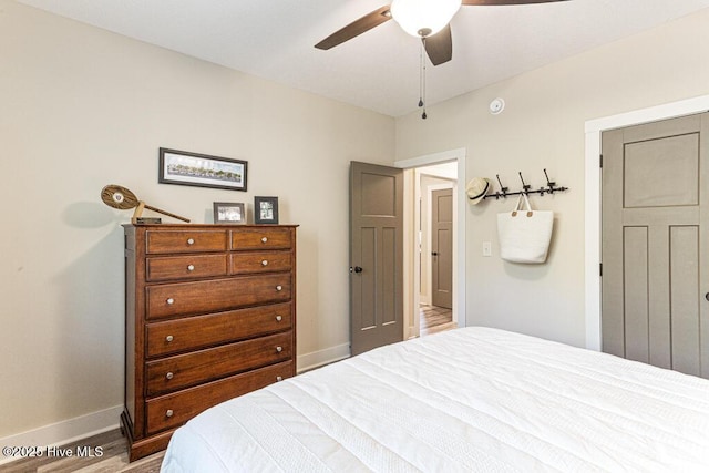 20 Barkley Ln, Pinehurst, NC 28374 - bedroom with baseboards, ceiling fan, and wood finished floors