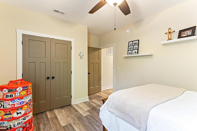 20 Barkley Ln, Pinehurst, NC 28374 - bedroom featuring a closet, baseboards, visible vents, ceiling fan, and wood finished floors