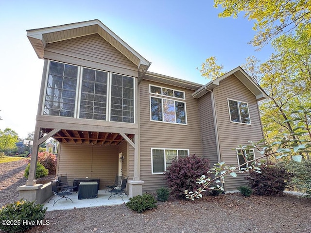 20 Barkley Ln, Pinehurst, NC 28374 - rear view of property featuring a patio area, cooling unit, and a sunroom