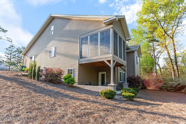 20 Barkley Ln, Pinehurst, NC 28374 - rear view of house with a sunroom
