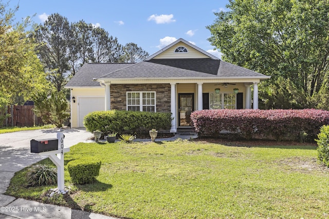604 Lanvale Hills Cir, Leland, NC 28451 - view of front of house featuring a front lawn, driveway, a shingled roof, a porch, and a garage