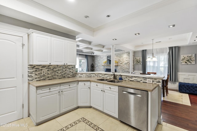 604 Lanvale Hills Cir, Leland, NC 28451 - kitchen featuring a peninsula, a sink, decorative backsplash, dishwasher, and light tile patterned floors
