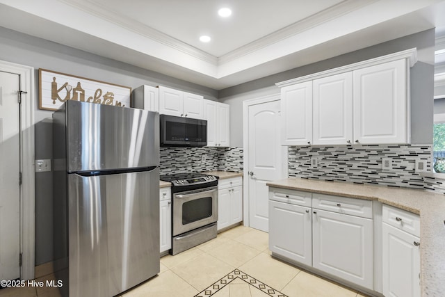 604 Lanvale Hills Cir, Leland, NC 28451 - kitchen with tasteful backsplash, white cabinetry, appliances with stainless steel finishes, light countertops, and ornamental molding