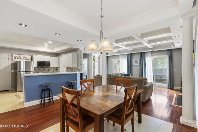 604 Lanvale Hills Cir, Leland, NC 28451 - dining area with ornamental molding, light wood-style flooring, and decorative columns