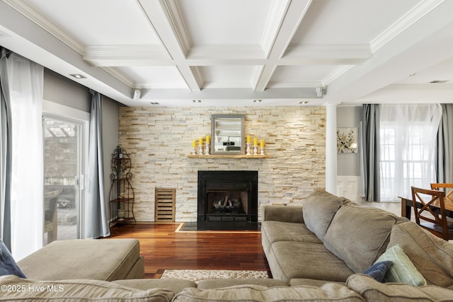 604 Lanvale Hills Cir, Leland, NC 28451 - living area featuring a stone fireplace, wood finished floors, beamed ceiling, coffered ceiling, and ornamental molding
