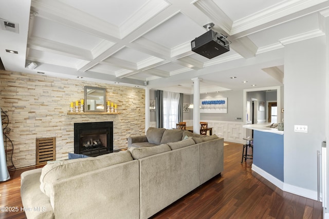 604 Lanvale Hills Cir, Leland, NC 28451 - living area featuring coffered ceiling, a stone fireplace, beamed ceiling, and ornate columns