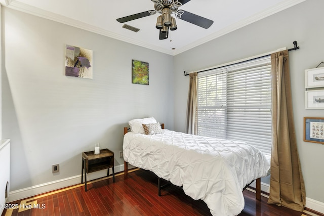 604 Lanvale Hills Cir, Leland, NC 28451 - bedroom with visible vents, baseboards, dark wood-type flooring, and ornamental molding