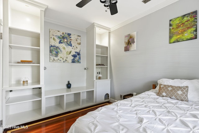 604 Lanvale Hills Cir, Leland, NC 28451 - bedroom with wood finished floors, visible vents, crown molding, and a ceiling fan