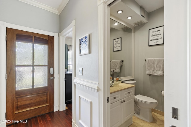 604 Lanvale Hills Cir, Leland, NC 28451 - bathroom with baseboards, toilet, vanity, and ornamental molding