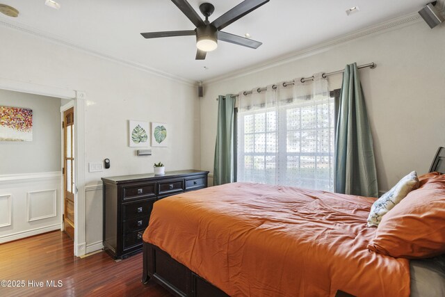 604 Lanvale Hills Cir, Leland, NC 28451 - bedroom featuring dark wood-type flooring, crown molding, ceiling fan, and wainscoting