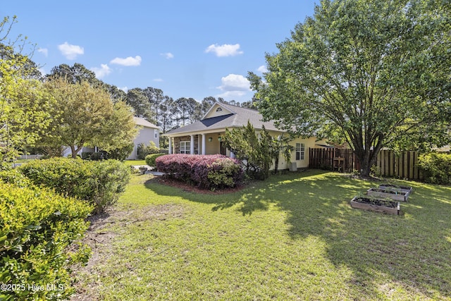 604 Lanvale Hills Cir, Leland, NC 28451 - view of yard with a vegetable garden and fence