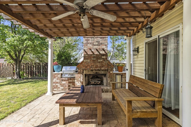 604 Lanvale Hills Cir, Leland, NC 28451 - view of patio featuring an outdoor kitchen, a grill, fence, a pergola, and an outdoor brick fireplace