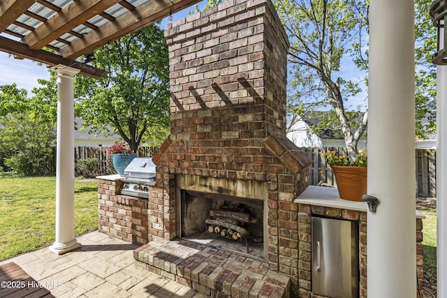 604 Lanvale Hills Cir, Leland, NC 28451 - view of patio / terrace featuring a pergola, fence, an outdoor kitchen, area for grilling, and an outdoor brick fireplace